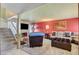 Cozy living room with plush seating, a stone fireplace, and modern decor creating a warm ambiance at 5019 Lancaster Dr, Las Vegas, NV 89120