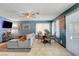 Living room with a comfortable sofa, dining space, and entertainment center, perfect for modern living at 5019 Lancaster Dr, Las Vegas, NV 89120