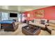 Inviting living area with a stone fireplace, plush seating, and a modern entertainment center at 5019 Lancaster Dr, Las Vegas, NV 89120