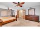 Spacious bedroom with ceiling fan, dresser, and wood accent doors at 5019 Lancaster Dr, Las Vegas, NV 89120