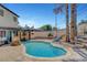 In-ground pool in backyard with patio furniture and covered patio visible at 5019 Lancaster Dr, Las Vegas, NV 89120