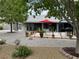 Beautiful backyard with a dining area, grill, and lovely landscaping at 5200 Wheatland Dr, Pahrump, NV 89061