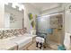 Bright bathroom with step-in shower, mosaic tiles, modern fixtures, and convenient accessibility features at 5200 Wheatland Dr, Pahrump, NV 89061