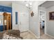 Light-filled entryway with tile flooring, a chandelier, and view to the bedroom at 5200 Wheatland Dr, Pahrump, NV 89061