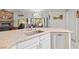 Bright kitchen featuring an island with sink, stainless steel dishwasher, granite counter tops, and a breakfast nook at 5200 Wheatland Dr, Pahrump, NV 89061