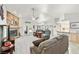 Spacious living room with a stone fireplace, high ceilings, and backyard access at 5200 Wheatland Dr, Pahrump, NV 89061