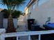 Exterior view of home featuring stucco walls, a gated entrance, and mature landscaping at 529 Rancho Del Mar Way, North Las Vegas, NV 89031