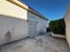 Exterior view of home featuring stucco walls, a gated entrance, and mature landscaping at 529 Rancho Del Mar Way, North Las Vegas, NV 89031