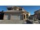 Charming two-story home showcasing a well-maintained lawn, classic stucco finish, and a two-car garage at 529 Rancho Del Mar Way, North Las Vegas, NV 89031