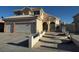 Two-story home showcasing a well-manicured lawn, classic stucco, and a spacious two-car garage at 529 Rancho Del Mar Way, North Las Vegas, NV 89031