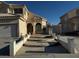 Inviting exterior featuring a well-maintained lawn, classic stucco finish, and a two-car garage at 529 Rancho Del Mar Way, North Las Vegas, NV 89031
