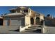 Charming two-story home featuring a well-maintained lawn, classic stucco finish, and a two-car garage at 529 Rancho Del Mar Way, North Las Vegas, NV 89031