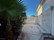 Exterior view of home featuring stucco walls, a gated entrance, and mature landscaping at 529 Rancho Del Mar Way, North Las Vegas, NV 89031
