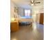 Bright bedroom with wood-look floors, decorative shelf, and a plush queen bed at 5381 Waving Sage Dr, Las Vegas, NV 89149