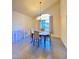 Cozy dining room featuring a chandelier, artwork and lots of natural light at 5381 Waving Sage Dr, Las Vegas, NV 89149