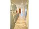 Spacious hallway with gray cabinets, hardwood floors, and bright lighting at 5381 Waving Sage Dr, Las Vegas, NV 89149