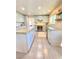 Modern kitchen featuring blue cabinets, an island, and stainless steel appliances at 5381 Waving Sage Dr, Las Vegas, NV 89149