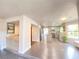 Open-concept kitchen and bar area, tile floors, updated appliances, and great natural light at 5381 Waving Sage Dr, Las Vegas, NV 89149