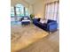 Sun-filled living room with modern rug, updated flooring, and great natural light at 5381 Waving Sage Dr, Las Vegas, NV 89149