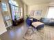 Inviting living room boasting a vaulted ceiling, large windows, and stylish decor at 5381 Waving Sage Dr, Las Vegas, NV 89149