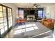 Bright living room with a fireplace, custom shelving, modern lighting, and a cozy seating area at 5381 Waving Sage Dr, Las Vegas, NV 89149