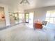 Spacious living area with kitchen view and sliding glass doors to backyard at 5381 Waving Sage Dr, Las Vegas, NV 89149