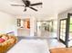 Open concept living space with tiled floor, breakfast bar, and kitchen beyond at 5381 Waving Sage Dr, Las Vegas, NV 89149