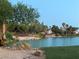 Scenic pond with grass and a view of houses at 5381 Waving Sage Dr, Las Vegas, NV 89149