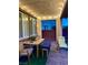 Inviting covered patio with outdoor furniture and ambient string lights at 5627 Spanish Valor Rd, Las Vegas, NV 89135