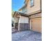 Two-story home with a paved driveway and a tan garage door, complemented by stone veneer accents at 5627 Spanish Valor Rd, Las Vegas, NV 89135
