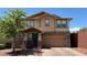 Charming two-story home with a two-car garage and landscaped front yard at 5627 Spanish Valor Rd, Las Vegas, NV 89135