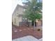 View of side of a two-story home with lush landscaping and a manicured front yard at 5627 Spanish Valor Rd, Las Vegas, NV 89135