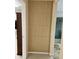 A hallway features stylish decorative wall panels and leads to an adjacent area and bathroom space at 5627 Spanish Valor Rd, Las Vegas, NV 89135