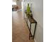 Hallway features stylish console table with decorative bottles, adding a touch of elegance at 5627 Spanish Valor Rd, Las Vegas, NV 89135