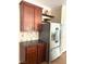 Contemporary kitchen featuring stainless steel appliances, stylish cabinets, and granite counters at 5627 Spanish Valor Rd, Las Vegas, NV 89135