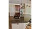 Gourmet kitchen island with granite countertops, modern sink fixtures, and breakfast bar seating at 5627 Spanish Valor Rd, Las Vegas, NV 89135
