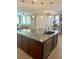 Spacious kitchen island with granite countertops and modern pendant lighting at 5627 Spanish Valor Rd, Las Vegas, NV 89135