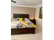 The Main bedroom has attractive decorative walls and bright floral bedding, enhancing the room's ambiance at 5627 Spanish Valor Rd, Las Vegas, NV 89135
