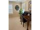 Office space has an ornate wooden desk, shutters on windows, and a potted plant, creating a productive atmosphere at 5627 Spanish Valor Rd, Las Vegas, NV 89135