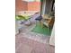 Inviting patio area featuring a cozy seating arrangement and a seamless blend of textures and outdoor decor at 5627 Spanish Valor Rd, Las Vegas, NV 89135