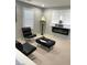 Sitting area features modern chairs, stylish lamps, and fireplace bringing warmth and sophistication at 5627 Spanish Valor Rd, Las Vegas, NV 89135