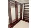 Spacious walk-in closet with custom shelves and multiple hanging rods for optimized storage solutions at 5627 Spanish Valor Rd, Las Vegas, NV 89135