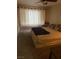 Relaxing bedroom features a large window, plush carpet, and room for a king-sized bed at 5710 E Tropicana Ave # 1053, Las Vegas, NV 89122