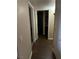An open hallway features wood-style floors, great lighting, and gives way to other rooms in the home at 5710 E Tropicana Ave # 1053, Las Vegas, NV 89122