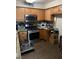 Functional kitchen with stainless steel appliances, ample counter space, and dark backsplash, perfect for cooking enthusiasts at 5710 E Tropicana Ave # 1053, Las Vegas, NV 89122