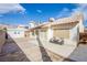 Spacious backyard featuring a patio, storage shed, and ample space for outdoor activities and relaxation at 6274 Elderberry Wine Ave, Las Vegas, NV 89142
