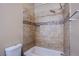 Bathroom with tile surround, shower head and built in storage shelf niche at 6274 Elderberry Wine Ave, Las Vegas, NV 89142