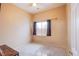 A simple carpeted bedroom offers a minimalist space with a window for natural light at 6274 Elderberry Wine Ave, Las Vegas, NV 89142