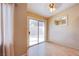 Cozy bedroom with wood floors and a sliding glass door to the outside at 6274 Elderberry Wine Ave, Las Vegas, NV 89142