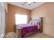 Comfortable bedroom featuring soft carpet, plush bedding, and natural light at 6274 Elderberry Wine Ave, Las Vegas, NV 89142